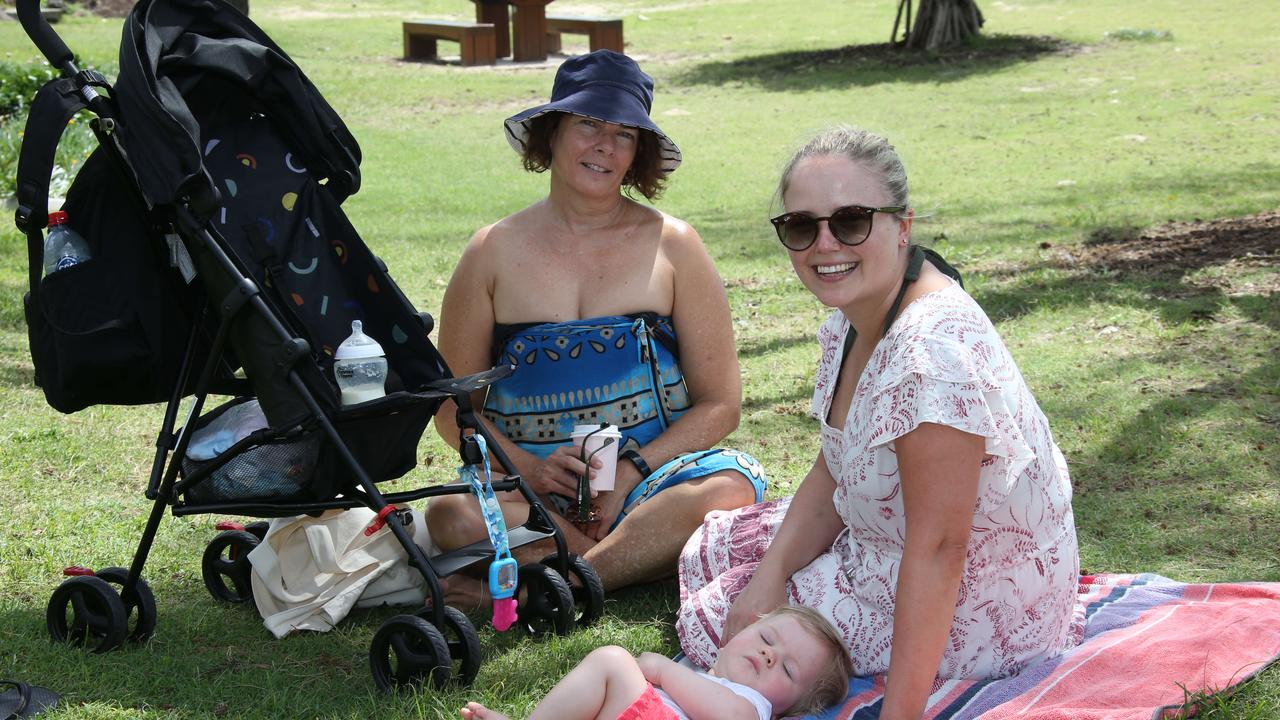 Michelle Cahill from Brisbane with Jesse Minnett and Harrison 10months.. Picture Glenn Hampson