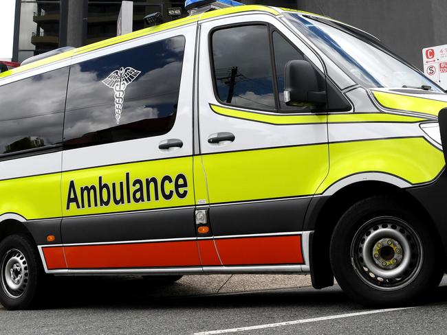 BRISBANE, AUSTRALIA - NewsWire Photos - JANUARY 13, 2021.An Ambulance leaves the Hotel Grand Chancellor in Spring Hill, Brisbane. Guests will be evacuated after six people linked to the building tested positive to the highly-contagious UK variant of the coronavirus.Picture: NCA NewsWire / Dan Peled