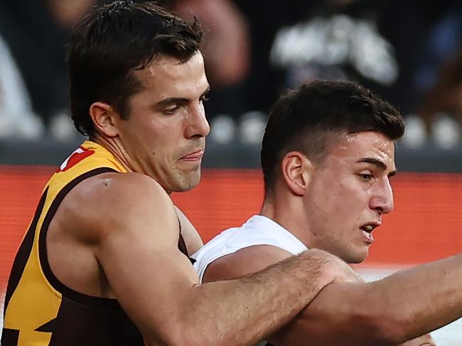 MELBOURNE, AUSTRALIA - August 5 , 2023. AFL .  Nick Daicos of the Magpies tackled by Finn Maginness of the Hawks  during the round 21 match between the Hawthorn and Collingwood at Marvel Stadium in Melbourne.   Photo by Michael Klein.