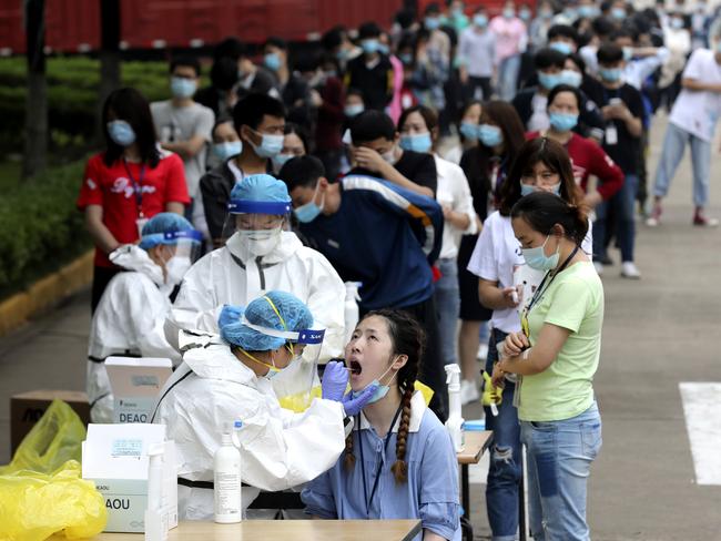 People line up for coronavirus tests in Wuhan on May 15. Picture: AP