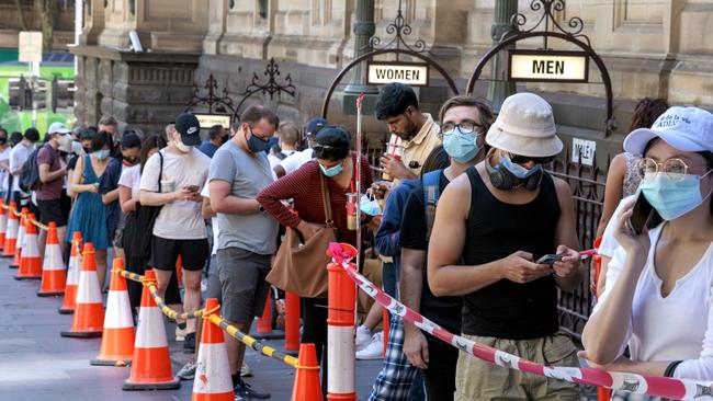 People queuing for Covid testing at Melbourne Town Hall as cases rise. Picture: David Geraghty