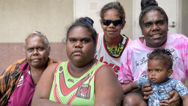 Doomadgee women Olive Roberts, Evelyn Ned, and Paula and Denise Booth, whose sister Betty died as a consequence of rheumatic heart disease and is one of three women whose deaths were subject to a coronial inquest, pictured with youngster Joel Ned-Anderson outside Cairns courthouse. Picture: Bronwyn Farr.