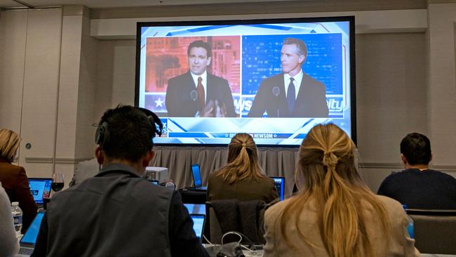 Ron DeSantis and Gavin Newsom appear on screen from the press room during a debate held by Fox News, in Alpharetta, Georgia, on Thursday night. Picture: AFP