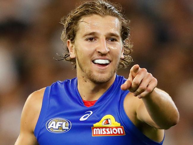 MELBOURNE, AUSTRALIA - MARCH 24: Marcus Bontempelli of the Bulldogs celebrates a goal during the 2017 AFL round 01 match between the Collingwood Magpies and the Western Bulldogs at the Melbourne Cricket Ground on March 24, 2017 in Melbourne, Australia. (Photo by Adam Trafford/AFL Media/Getty Images)