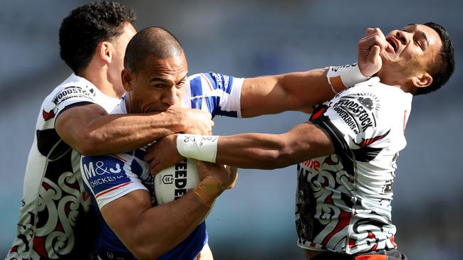 Canterbury’s Will Hopoate tries to fend off the Warriors defence at ANZ Stadium. Picture: Getty Images