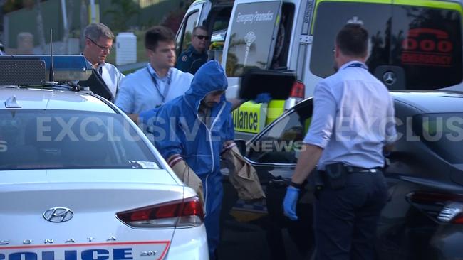 Gold Coast councillor Ryan Bayldon-Lumsden in a forensics suit being taken into custody by Queensland police. Picture: Supplied by 7 News Gold Coast.