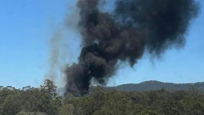 Police and fire crews were called to a fire off of the Old Pacific Hwy in Pimpama around 10.50am on Friday.  Photo: Brianna Hunter/Facebook