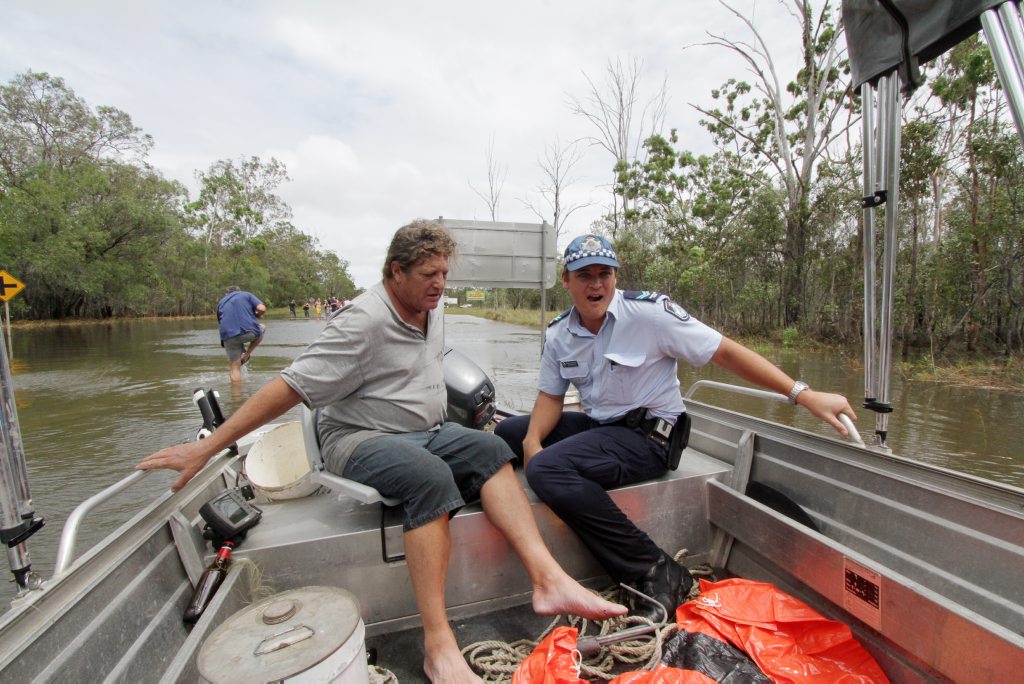 Rob Hart and a constable accompanied by journalist and photographer to Aldershot where a number of people are stranded. Photo: Robyne Cuerel / Fraser Coast Chronicle. Picture: Robyne Cuerel