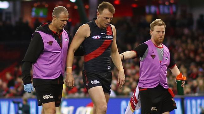 Brendon Goddard walks off the ground after hurting his knee. Picture: Getty Images