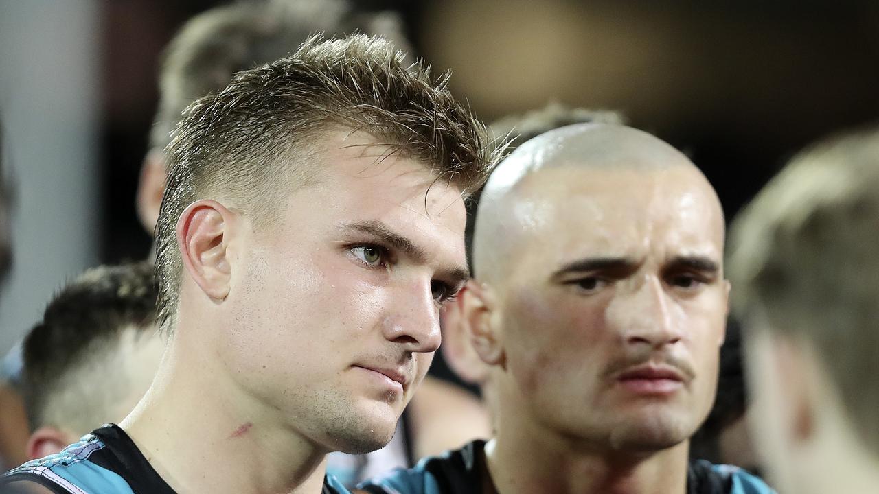 Ollie Wines and Sam Powell-Pepper listen to Ken Hinkley at three-quarter time against Richmond. Picture: Sarah Reed