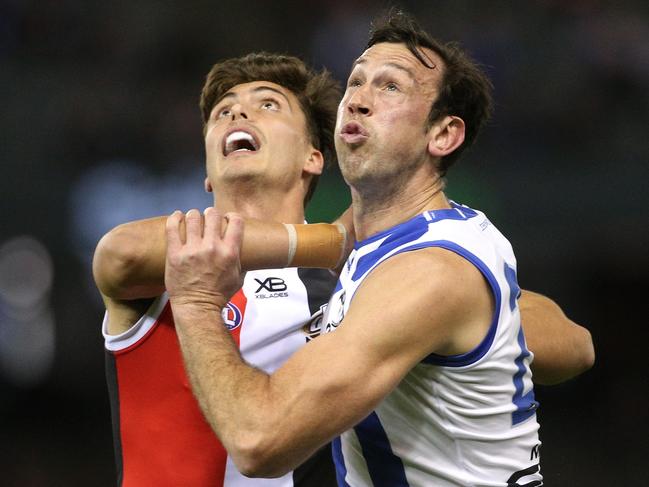 Lewis Pierce of the Saints (left) and Todd Goldstein of the Kangaroos contest the ruck during the Round 23 AFL match in 2018. Picture: Hamish Blair