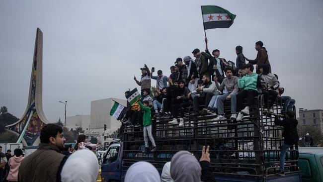 People gather to celebrate in Umayyad Square on December 11, 2024 in Damascus, Syria.