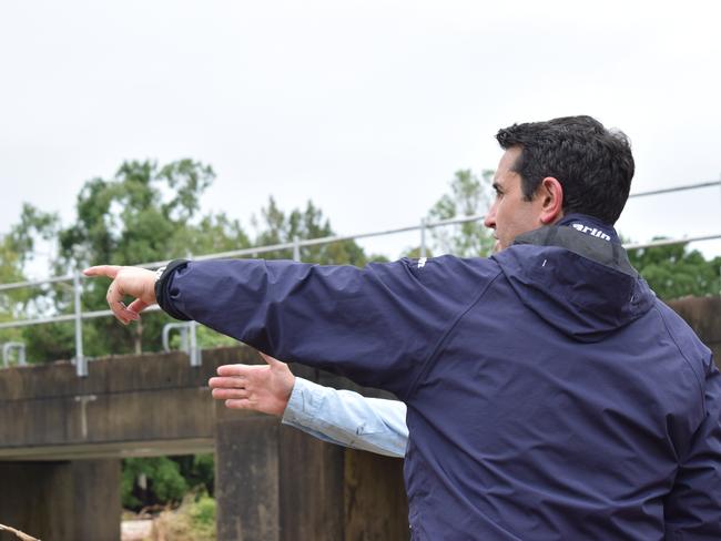 Queensland Premier David Crisafulli at the site of Ollera Creek which was damaged by flood waters at the start of February 2025.