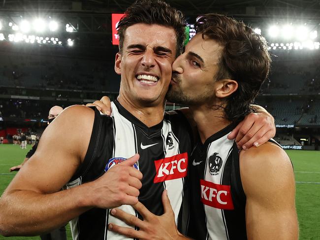 MELBOURNE.  19/03/2022.   AFL. Round 1.  St Kilda vs Collingwood at the Marvel Stadium . Josh Daicos gives brother Nick a kiss after their round 1 win over St Kilda   . Photo by Michael Klein