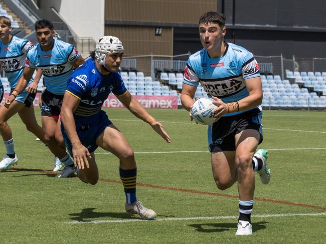 Sharks halfback Riley Pollard takes on the line. Picture: Adam Wrightson Photography