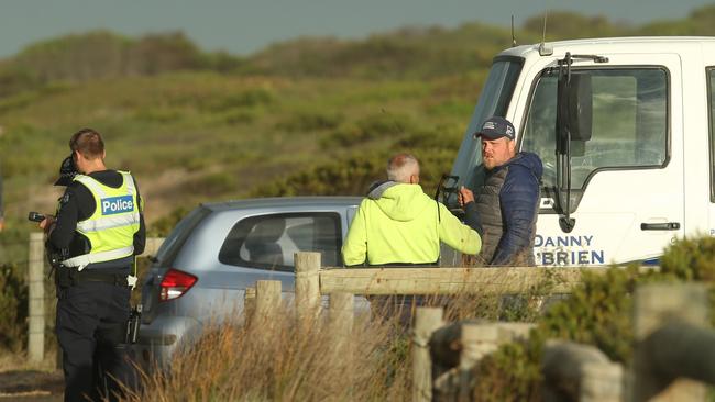 Staff for Danny O’Brien Racing talk with police following the death of stablehand Takamasa Takeda near Barwon Heads in 2020. Picture: Alan Barber