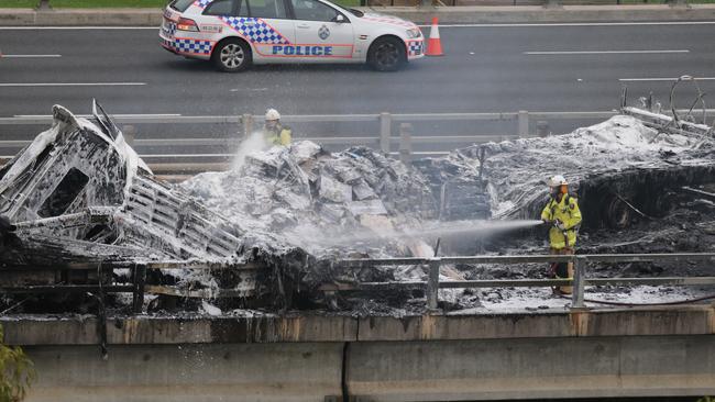 Firefighters and emergency services at the scene of a truck crash on the M1 bridge over the Nerang River. Picture: Glenn Hampson