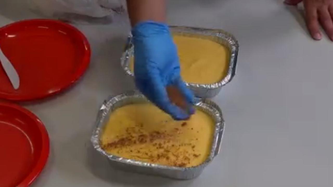 The prisoner puts his finishing touches on the custard slice.