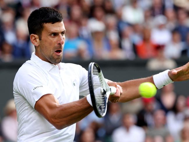 LONDON, ENGLAND - JULY 05: Novak Djokovic of Serbia plays a forehand against Jordan Thompson of Australia in the Men's Singles second round match during day three of The Championships Wimbledon 2023 at All England Lawn Tennis and Croquet Club on July 05, 2023 in London, England. (Photo by Patrick Smith/Getty Images)