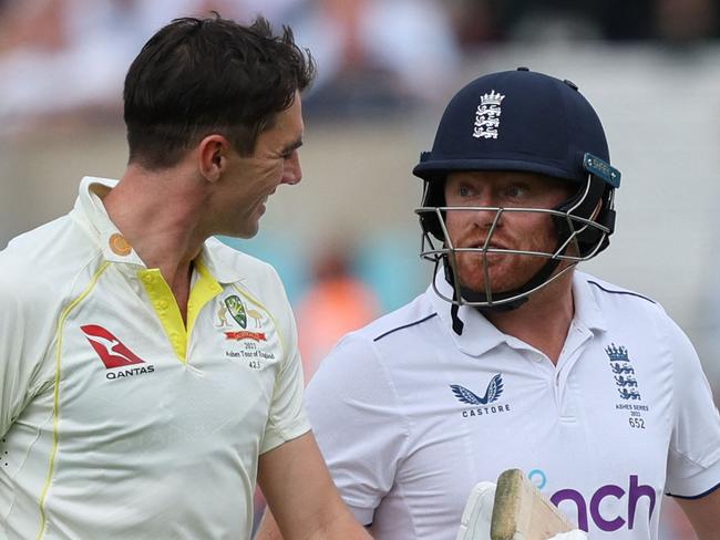 Australia's Pat Cummins chats with England's Jonny Bairstow (R) on day three of the fifth Ashes cricket Test match between England and Australia at The Oval cricket ground in London on July 29, 2023. (Photo by Adrian DENNIS / AFP) / RESTRICTED TO EDITORIAL USE. NO ASSOCIATION WITH DIRECT COMPETITOR OF SPONSOR, PARTNER, OR SUPPLIER OF THE ECB