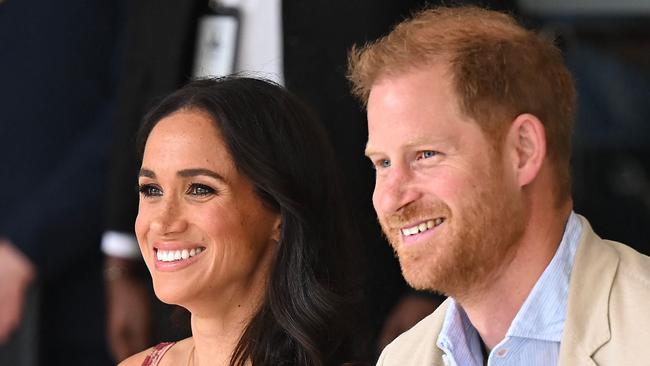 Britain's Prince Harry (R), Duke of Sussex, and his wife Meghan Markle are pictured during a visit to the National Centre for the Arts in Bogota on August 15, 2024. Prince Harry and his wife, American actress Meghan Markle, arrived in Colombia at the invitation of Marquez, with whom they will attend various meetings with women and young people to reject discrimination and cyberbullying. (Photo by RAUL ARBOLEDA / AFP)