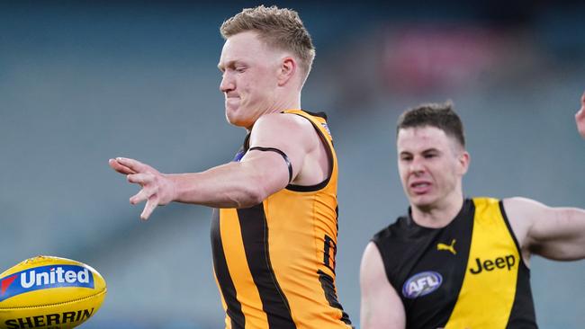 James Sicily of the Hawks runs with the ball during the Round 3 AFL Match between the Richmond Tigers and the Hawthorn Hawks at the MCG in Melbourne, Thursday, June 18, 2020. (AAP Image/Michael Dodge) NO ARCHIVING, EDITORIAL USE ONLY