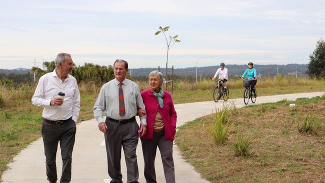 Clarence MP Chris Gulaptis with Clarence Valley Council Mayor Jim Simmons and his wife Lexie. A cycleway from Townsend to Maclean will be completed with state government funding. Bob and Judith Little from Maclean (in background) are frequent users of the pathway that traverses from the Maclean Interchange to Townsend and are looking forward to it linking to existing pathways at Townsend and Maclean.