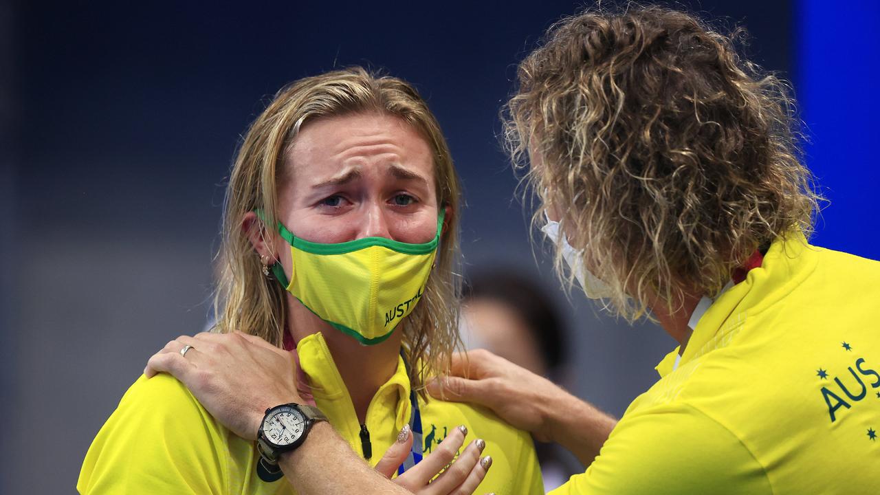 Ariarne Titmus hugs her coach Dean Boxall after the medal ceremony at the Tokyo Aquatic Centre at the 2020 Tokyo Olympics. Pics Adam Head