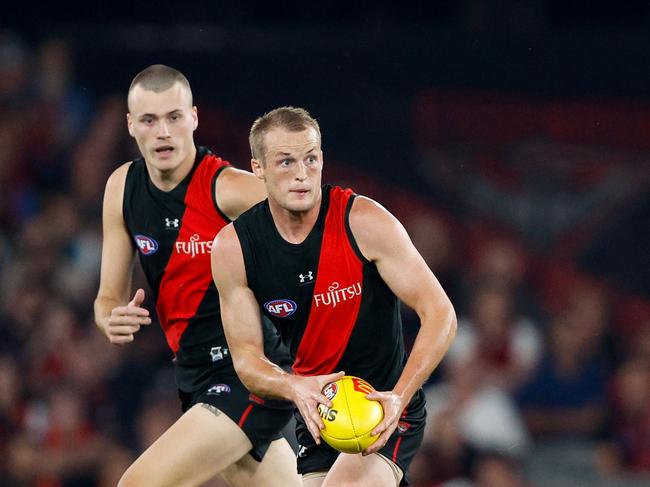 MELBOURNE, AUSTRALIA - MARCH 30: Mason Redman of the Bombers in action during the 2024 AFL Round 03 match between the Essendon Bombers and the St Kilda Saints at Marvel Stadium on March 30, 2024 in Melbourne, Australia. (Photo by Dylan Burns/AFL Photos via Getty Images)