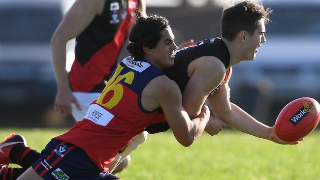 Hillside recruit Corey Wright tackles an opponent while playing for Diggers Rest. Picture: Andy Brownbill