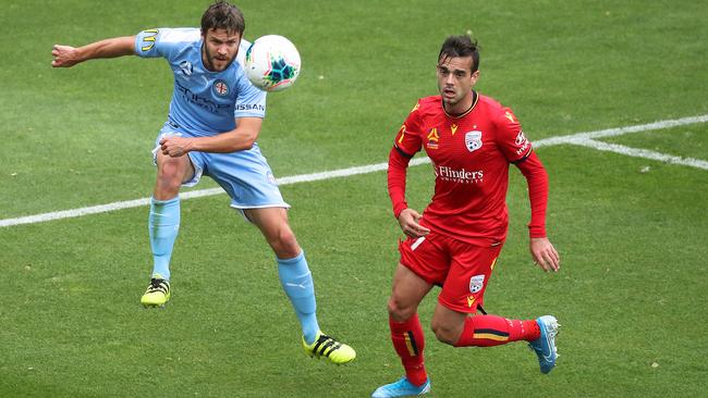 Adelaide United winger Nikola Mileusnic shuts down Melbourne City’s Richard Windbichler at AAMI Park. Picture: AAP Image/George Salpigtidis