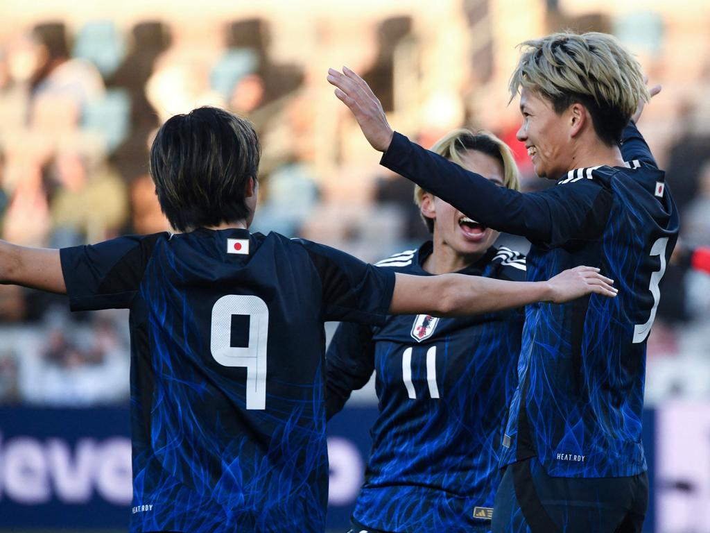 Japan’s Moeka Minami (right) celebrates with teammates after scoring in her side’s 4-0 win over Australia. Picture: Mark Felix / AFP