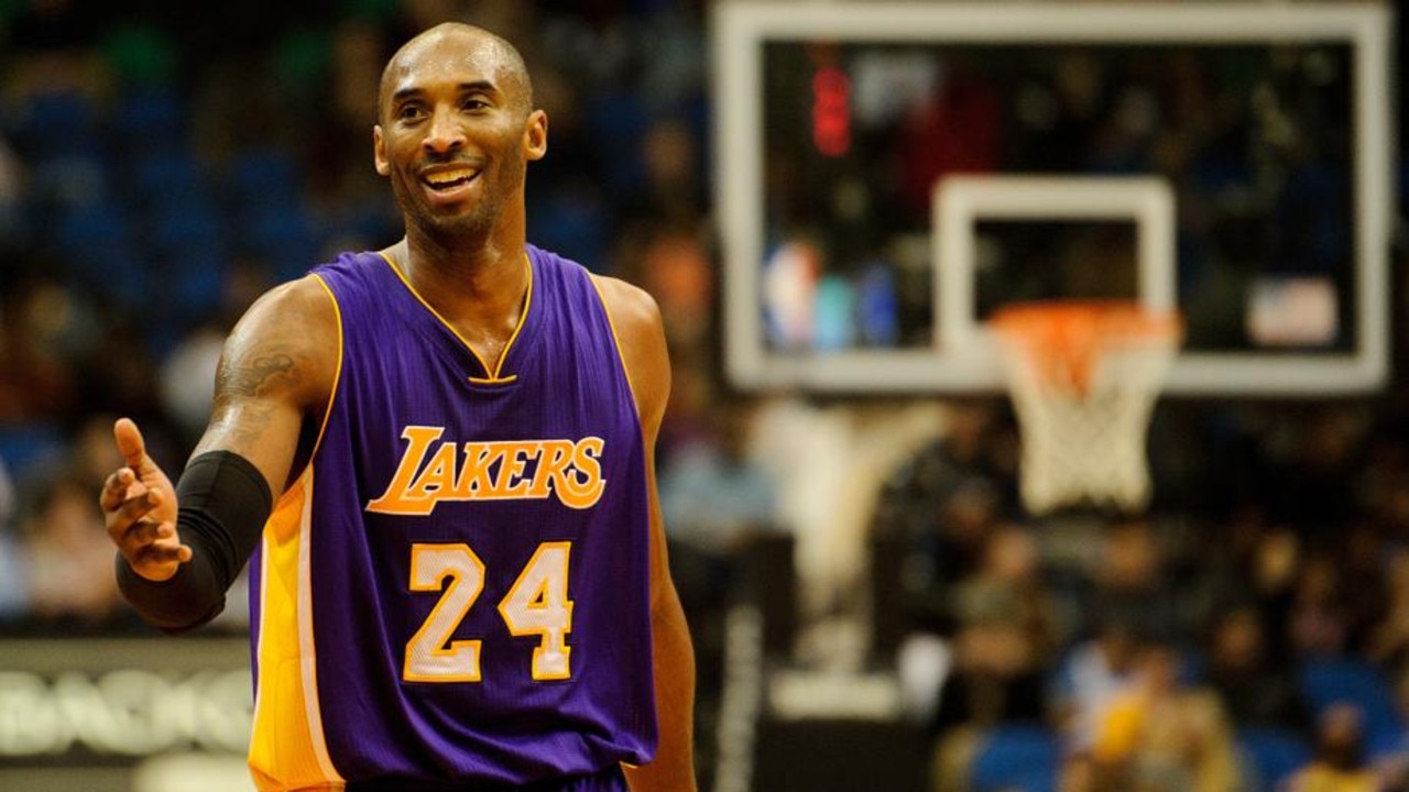 NBA - Kobe Bryant #24 of the Los Angeles Lakers adjusts his jersey