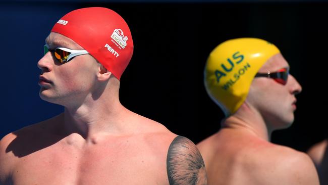 England 's Adam Peaty (left) got the betteer of Australia's Matt Wilson in their men’s 100m breaststroke heat this morning. Photo: AFP