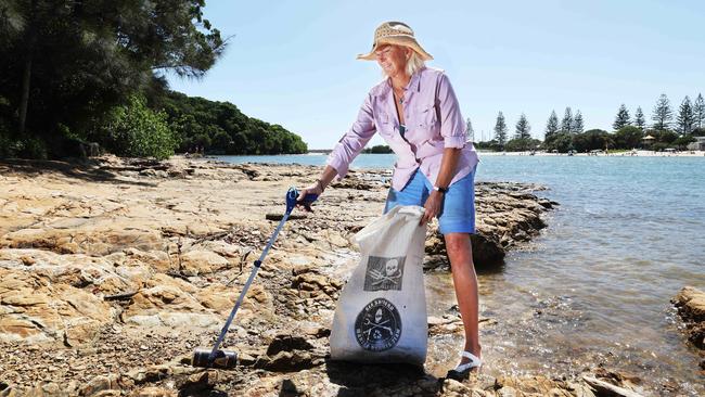 Tallebudgera Creek "fairy" Dr Sally Gregory cleaning up the beach and waterways near Tallebudgera Creek, as part of an effort to minimise harm to the environment. Picture Glenn Hampson