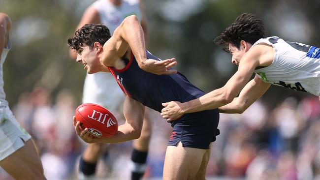 Christian Petracca tries to break away from a tackle against the Blues. Picture: Wayne Ludbey