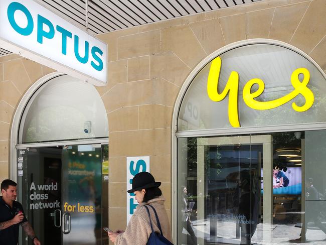 SYDNEY, AUSTRALIA: Newswire Photos- NOVEMBER 08 2023: People are seen walking past the Optus shop in North Sydney as they have a massive outage today across their network leaving thousands of customers and businesses without phone or internet service. Photo by: NCA Newswire /Gaye Gerard