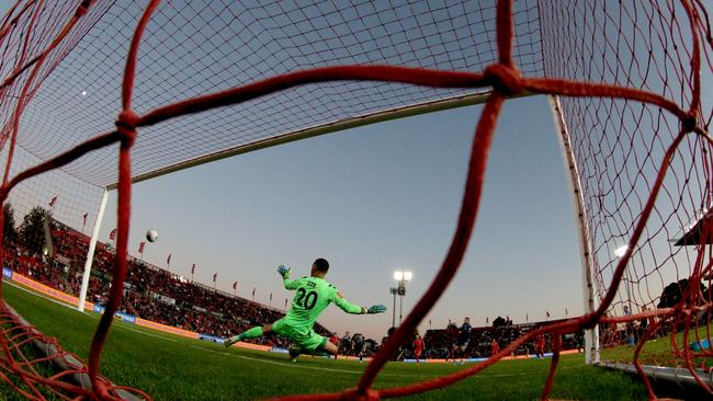 Sydney’s Adam Le Fondre scores a penalty past Adelaide goalkeeper Paul Izzo. Picture: AAP