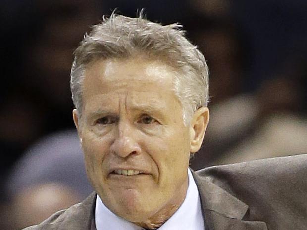 The Philadelphia 76ers head coach Brett Brown argues a call to referee Pat Fraher (26) in the second half of an NBA basketball game against the Charlotte Hornets in Charlotte, N.C., Friday, Nov. 20, 2015. The Hornets won 113-88. (AP Photo/Bob Leverone)