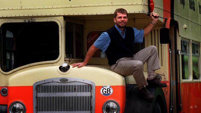 Founder of Top Deck Travel company Graham Turner with one of his old buses in October 1999. Picture: Brett Faulkner