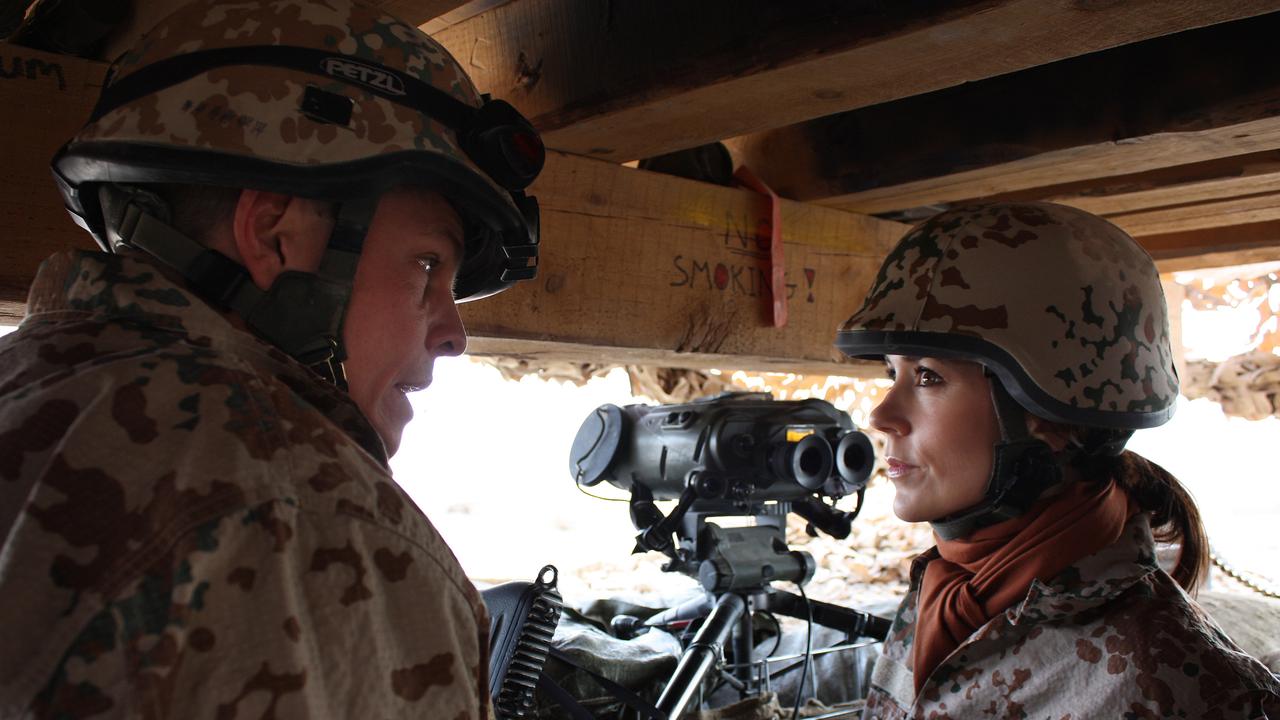 Danish Crown Princess Mary speaks to a soldier during her visit to the Danish troops in Helmand, Afghanistan, in November 2009.