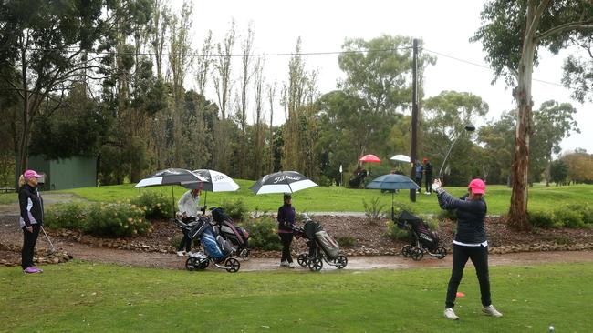 Sue Jackson tees off on the 10th hole at Box Hill Golf Course. Picture: Hamish Blair