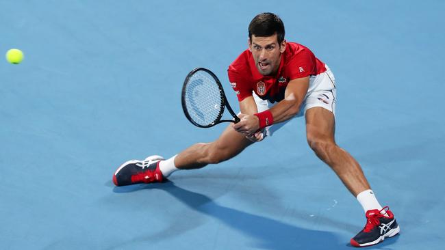 Novak Djokovic stretches for a backhand return to Rafael Nadal during their singles match in the ATP Cup final at Ken Rosewall Arena. Picture: Getty Images