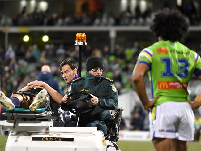 Iosia Soliola of the Raiders watches Billy Slater of the Storm being stretchered off during the Round 20 NRL match between the Canberra Raiders and the Melbourne Storm at GIO Stadium in Canberra, Saturday, July 22, 2017. (AAP Image/Mick Tsikas) NO ARCHIVING, EDITORIAL USE ONLY