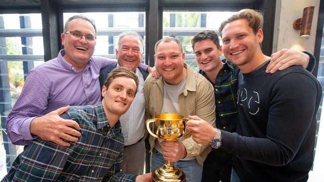 Lanskey family are having lunch at Stokehouse St Kilda to celebrate their horse Vow and Declare winning the Melbourne Cup yesterday. The Lanskey boys, Anthony with sons Ben (2nd from left bending down) and Lachi (2nd from right) and Paul with sons Joseph (centre beige jacket) and Tom (far right). Picture: Mark Stewart