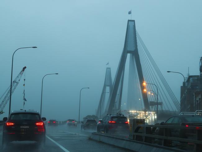 Heavy rain settles over Sydney on Thursday morning. Picture: John Grainger