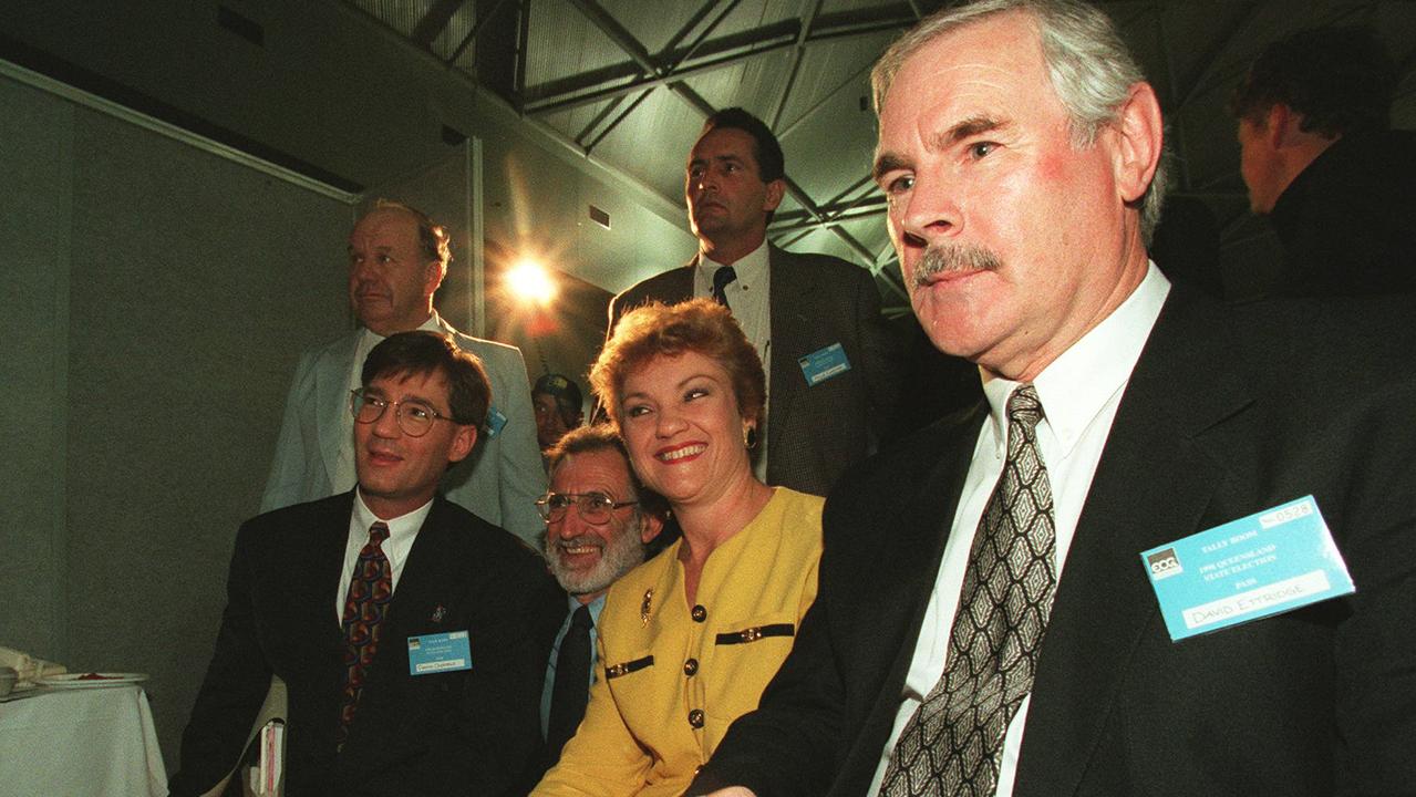 Pauline Hanson with David Oldfield, seated on the left, and David Ettridge, right, at the tally room on the 1998 Queensland election night.