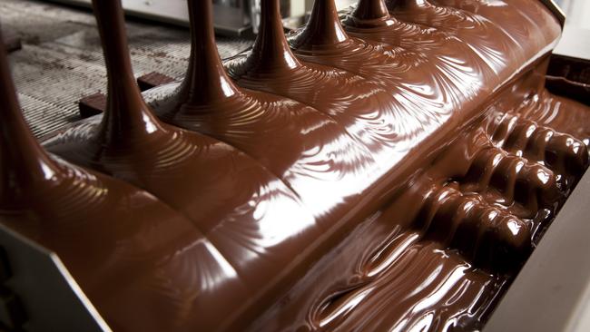 Enrobing (chocolate coating) gets under way at Haigh's Chocolates production line.