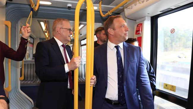 Premier Steven Miles and Prime Minister Anthony Albanese ride on the light rail on the Gold Coast. Picture: Adam Head