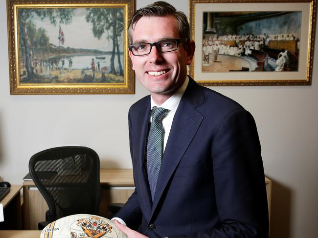 A mad Wests Tigers fan,  Dominic Perrottet, NSW Treasurer, at his office at State Parliament with a West Tigers football. pic Mark Evans